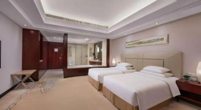 Bed in New Century Grand Changchun Hotel