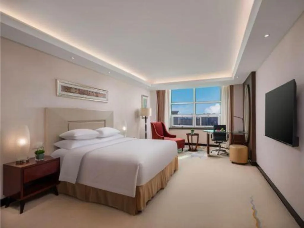Bed in New Century Grand Changchun Hotel