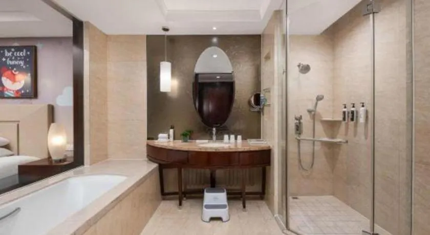 Bed in New Century Grand Changchun Hotel