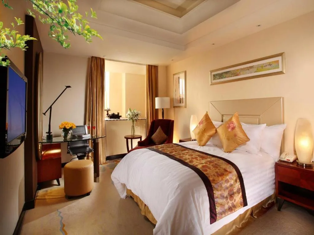 Bed in New Century Grand Changchun Hotel