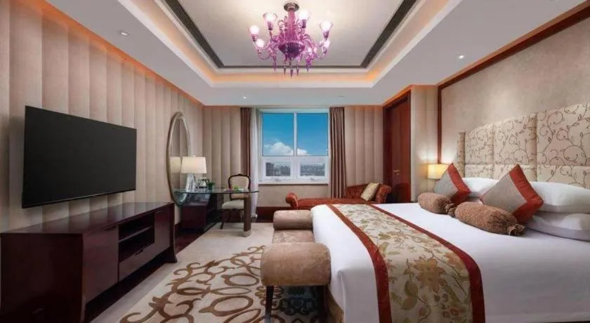 Bed in New Century Grand Changchun Hotel