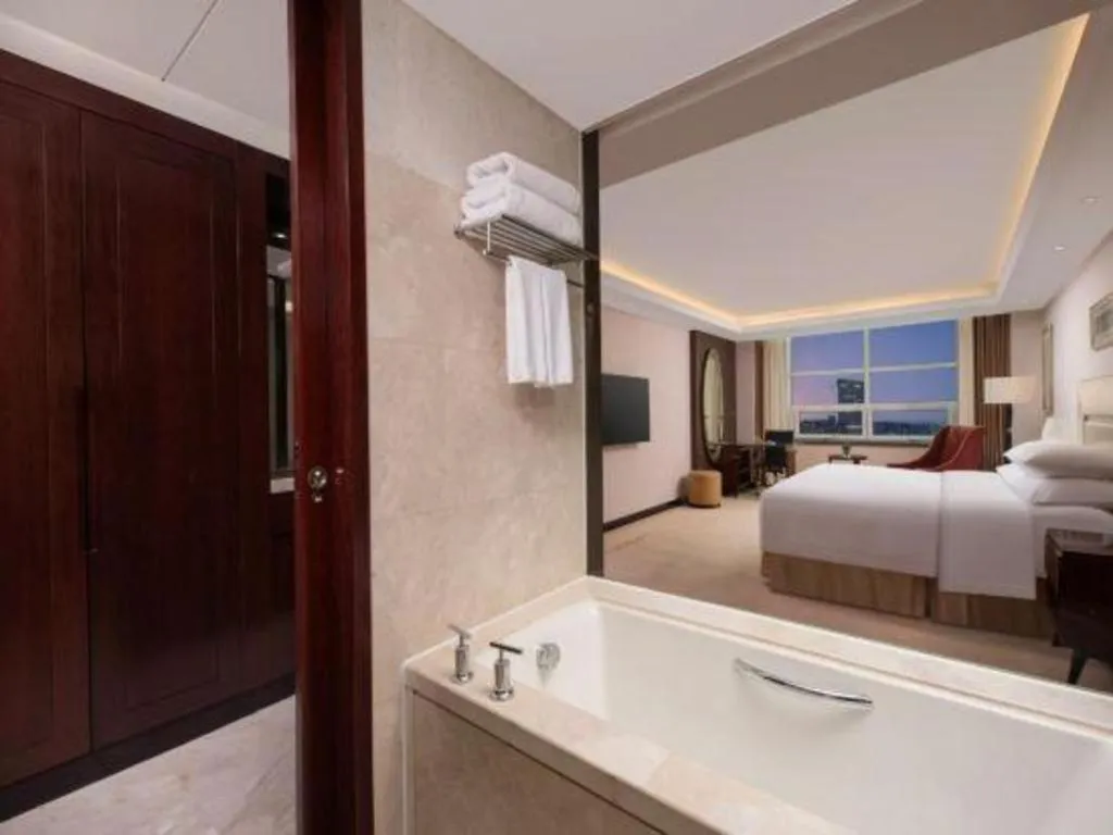 Bed in New Century Grand Changchun Hotel