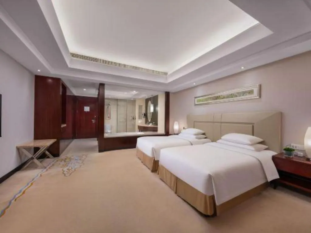 Bed in New Century Grand Changchun Hotel