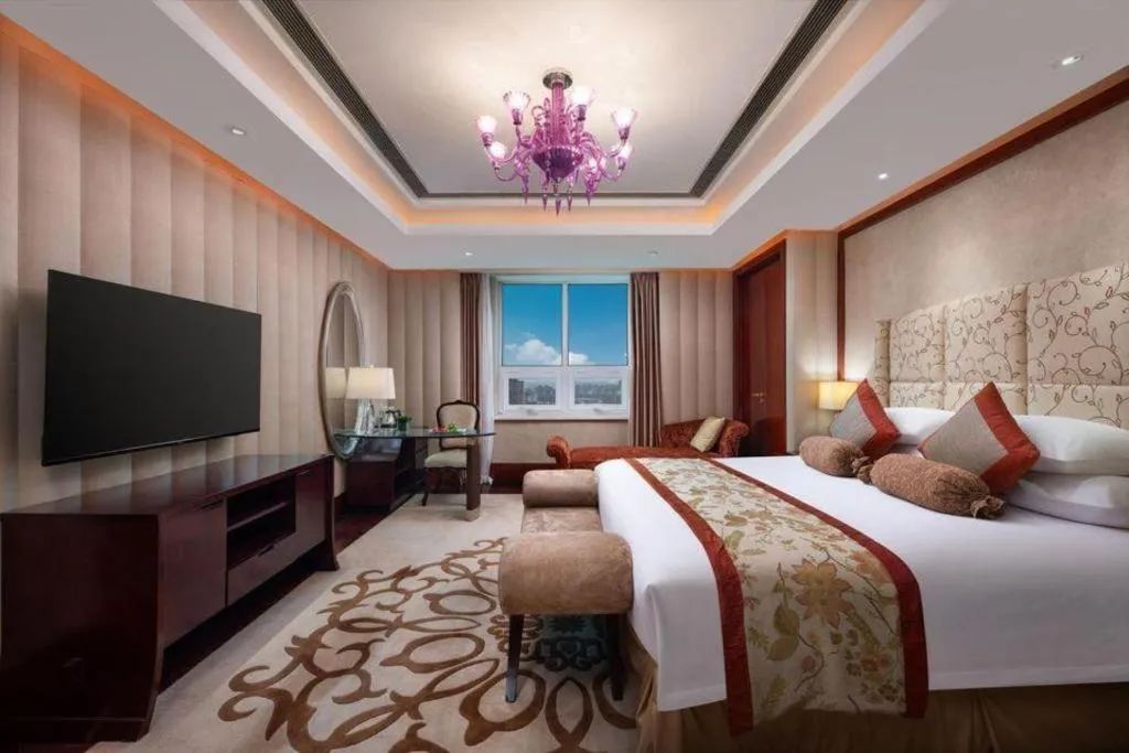 Bed in New Century Grand Changchun Hotel