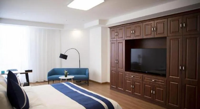 Bed in New Century Grand Changchun Hotel