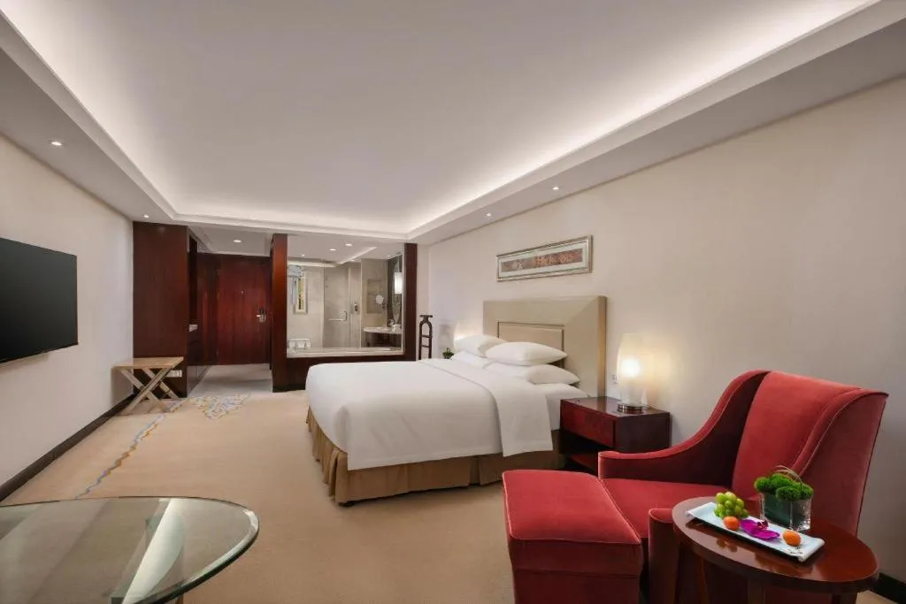 Bed in New Century Grand Changchun Hotel