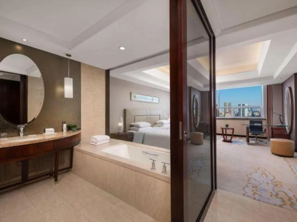 Bed in New Century Grand Changchun Hotel