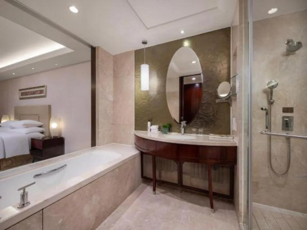 Bed in New Century Grand Changchun Hotel