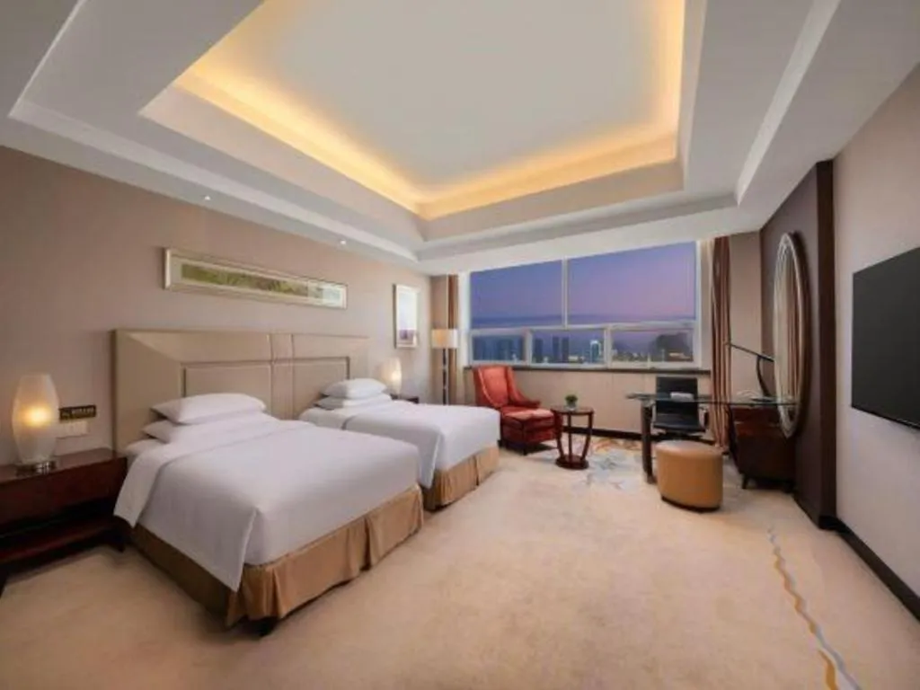 Bed in New Century Grand Changchun Hotel