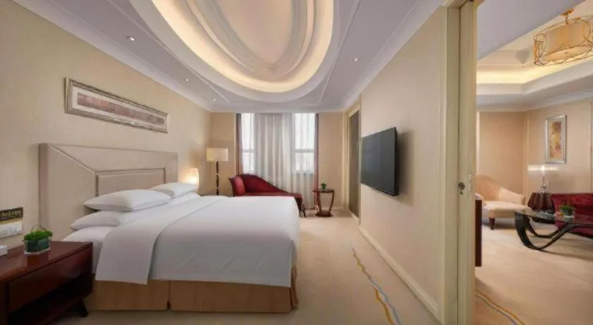 Bed in New Century Grand Changchun Hotel