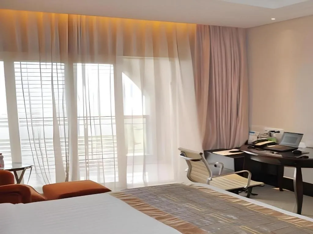 Bed in New Century Grand Hotel Xuzhou