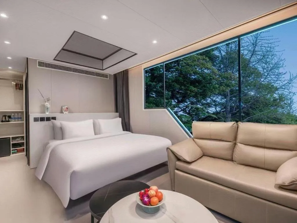 Bed in New Century Grand Hotel Xuzhou