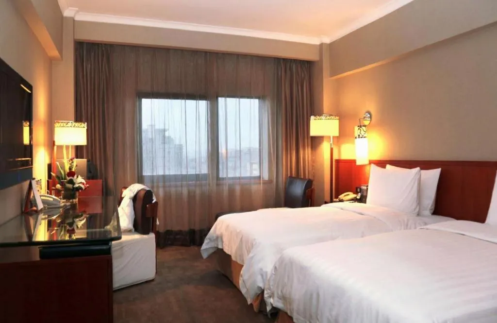 Bed in Xian Grand Noble Hotel