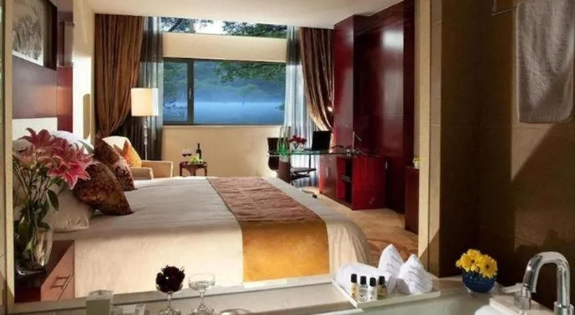 Bed in New Century Hotel Zaozhuang Fengming
