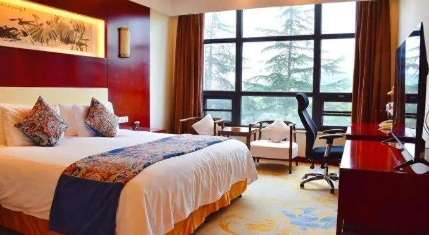 Bed in New Century Hotel Zaozhuang Fengming