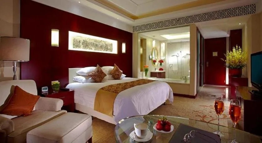Bed in New Century Hotel Zaozhuang Fengming