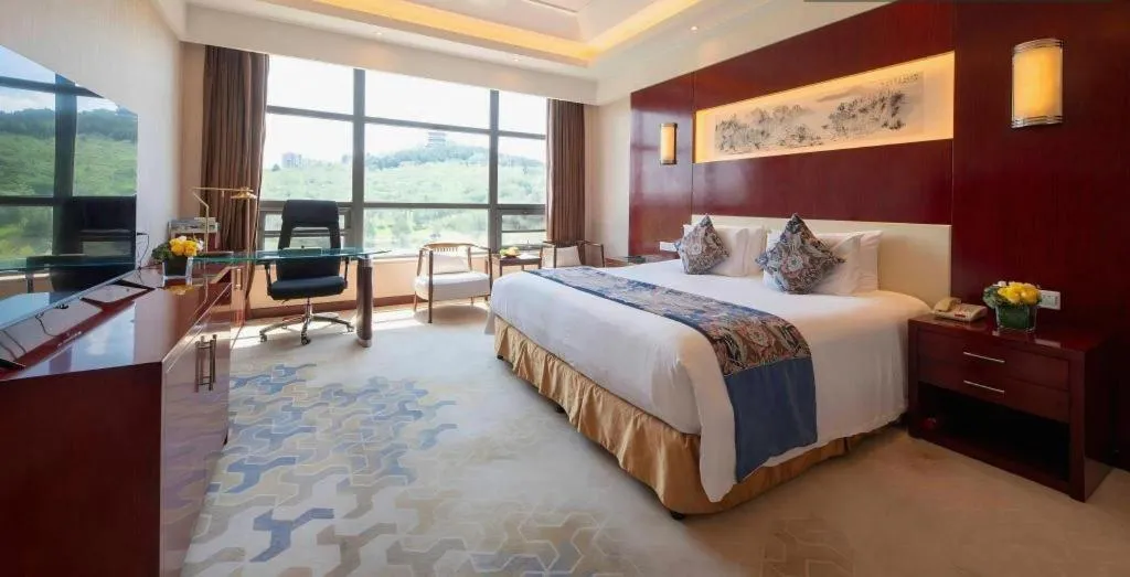 Bed in New Century Hotel Zaozhuang Fengming