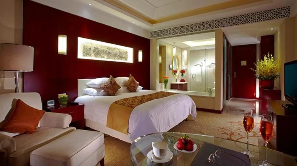 Bed in New Century Hotel Zaozhuang Fengming