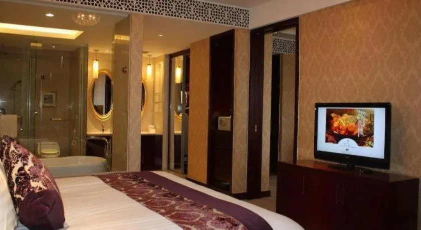 Bed in New Century Hotel Zaozhuang Fengming