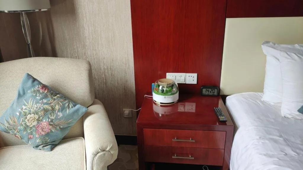 Bed in New Century Hotel Zaozhuang Fengming