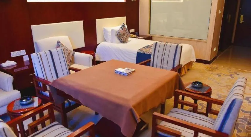 Bed in New Century Hotel Zaozhuang Fengming