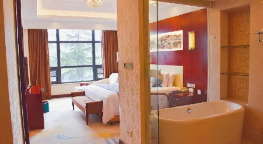 Bed in New Century Hotel Zaozhuang Fengming