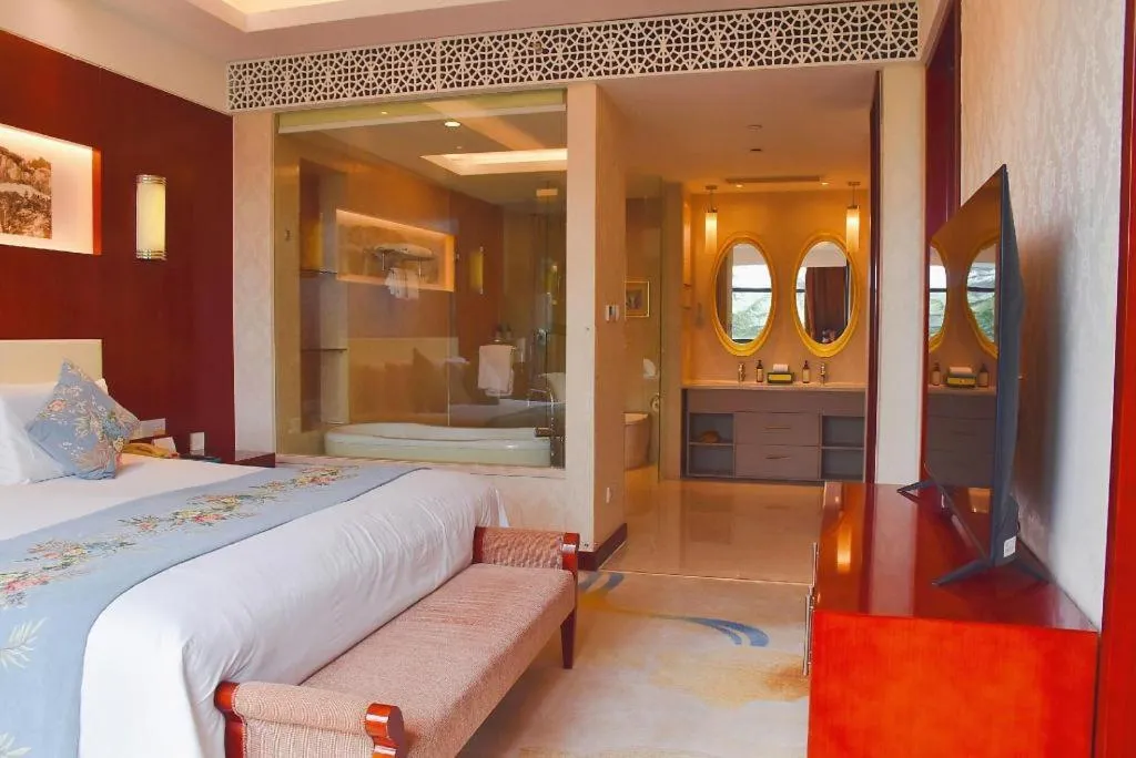 Bed in New Century Hotel Zaozhuang Fengming