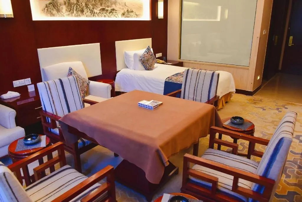 Bed in New Century Hotel Zaozhuang Fengming