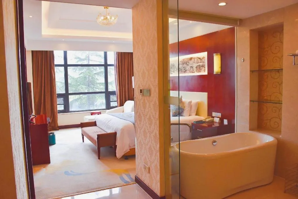 Bed in New Century Hotel Zaozhuang Fengming