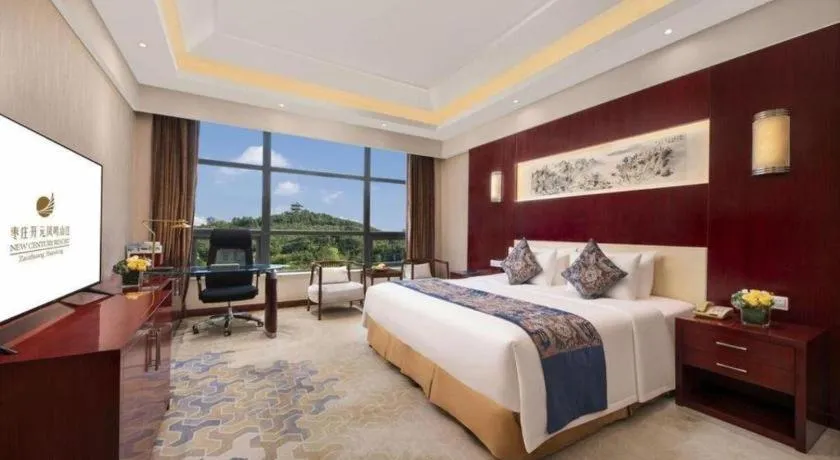 Bed in New Century Hotel Zaozhuang Fengming