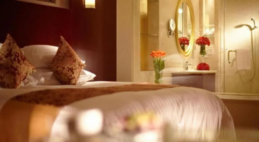 Bed in New Century Hotel Zaozhuang Fengming