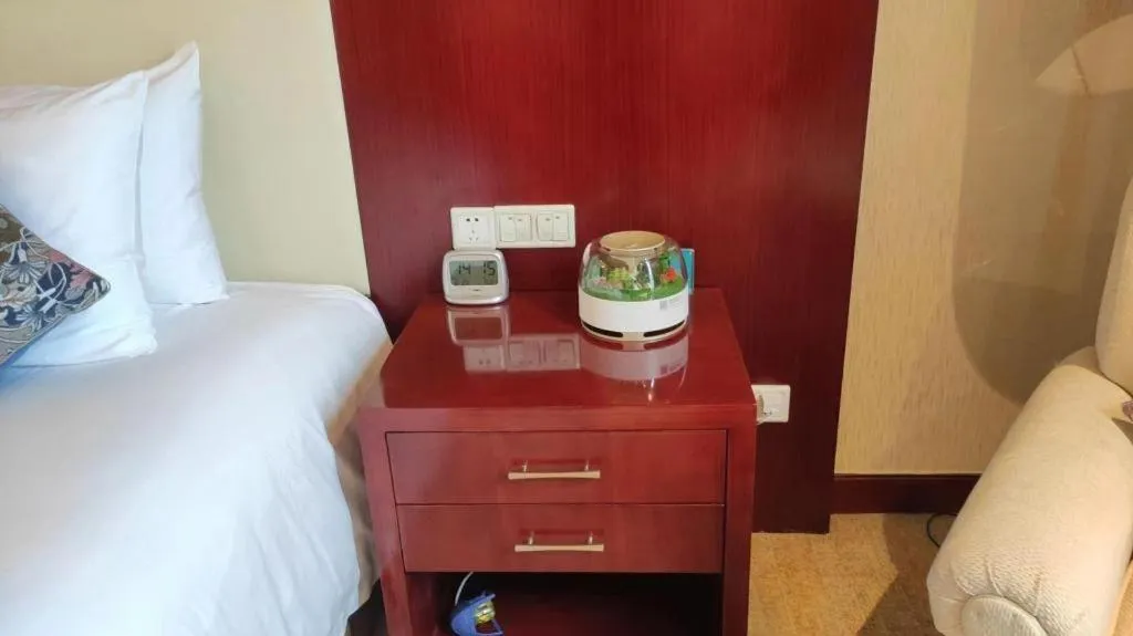 Bed in New Century Hotel Zaozhuang Fengming