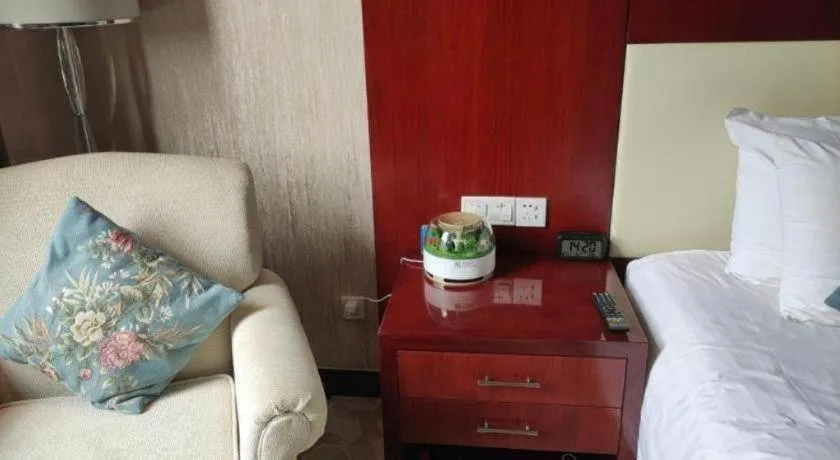 Bed in New Century Hotel Zaozhuang Fengming