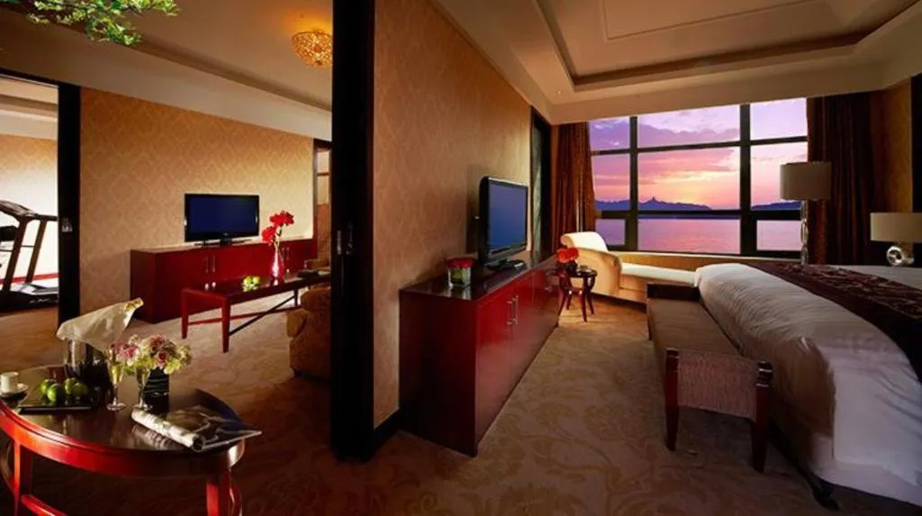 Bed in New Century Hotel Zaozhuang Fengming