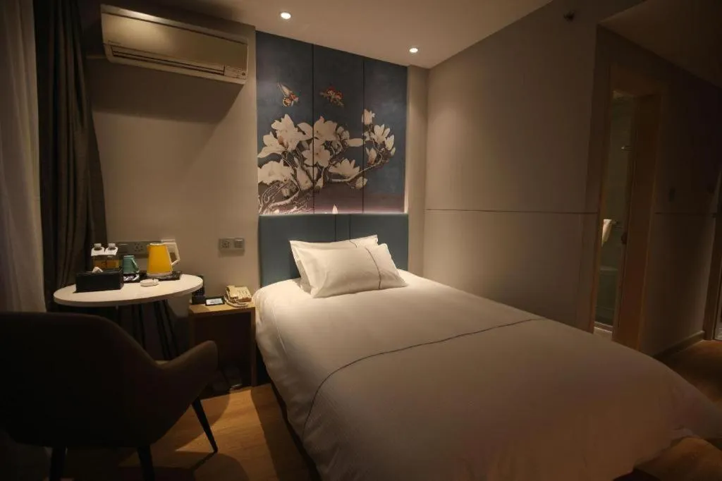 Bed in Magnotel Business Xuzhou Jinying Sudi Road Metro Station