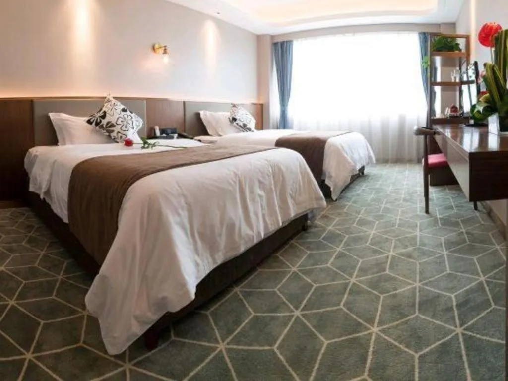 Bed in Guilin Plaza Hotel