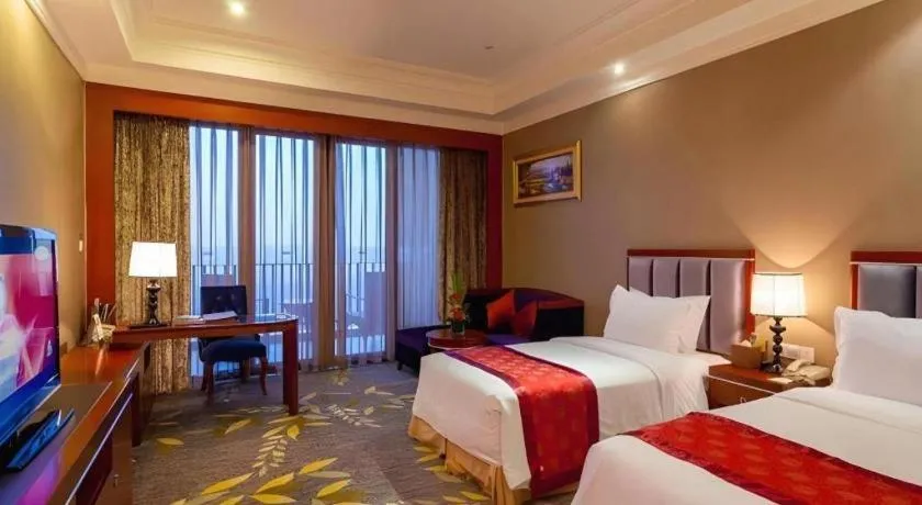 Bed in Xinjin Celebrity City Hotel