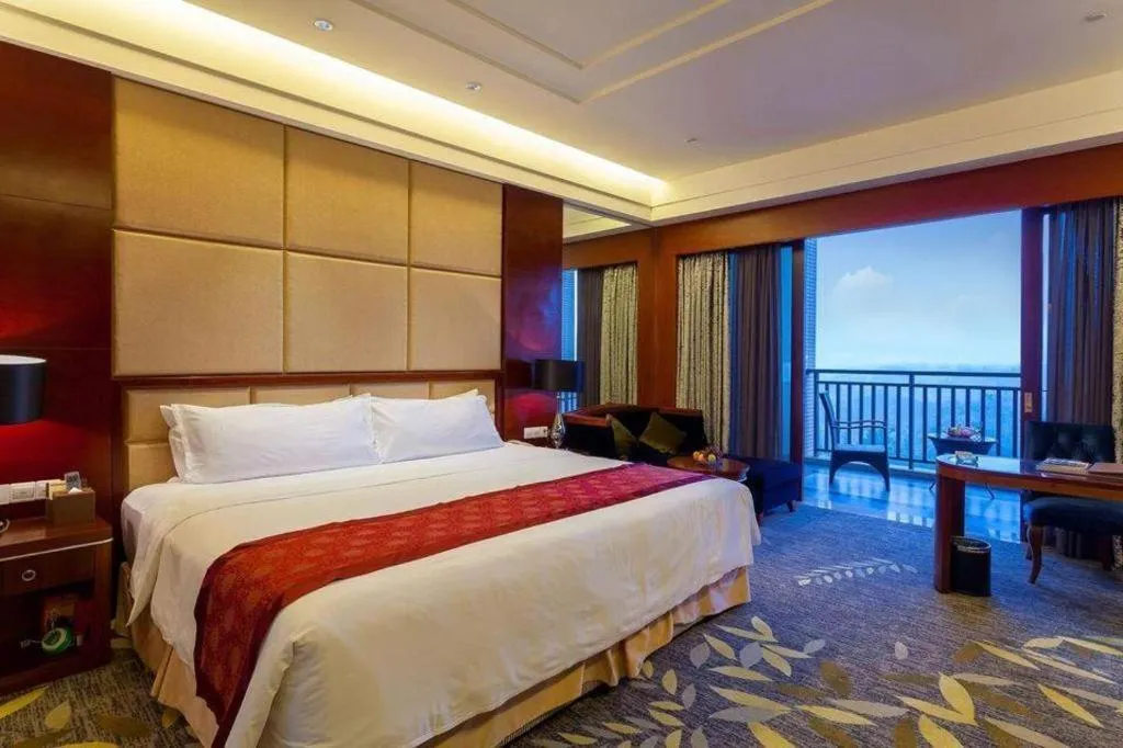 Bed in Xinjin Celebrity City Hotel