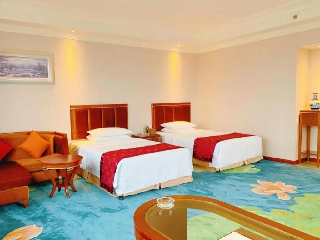 Bed in Xinjin Celebrity City Hotel