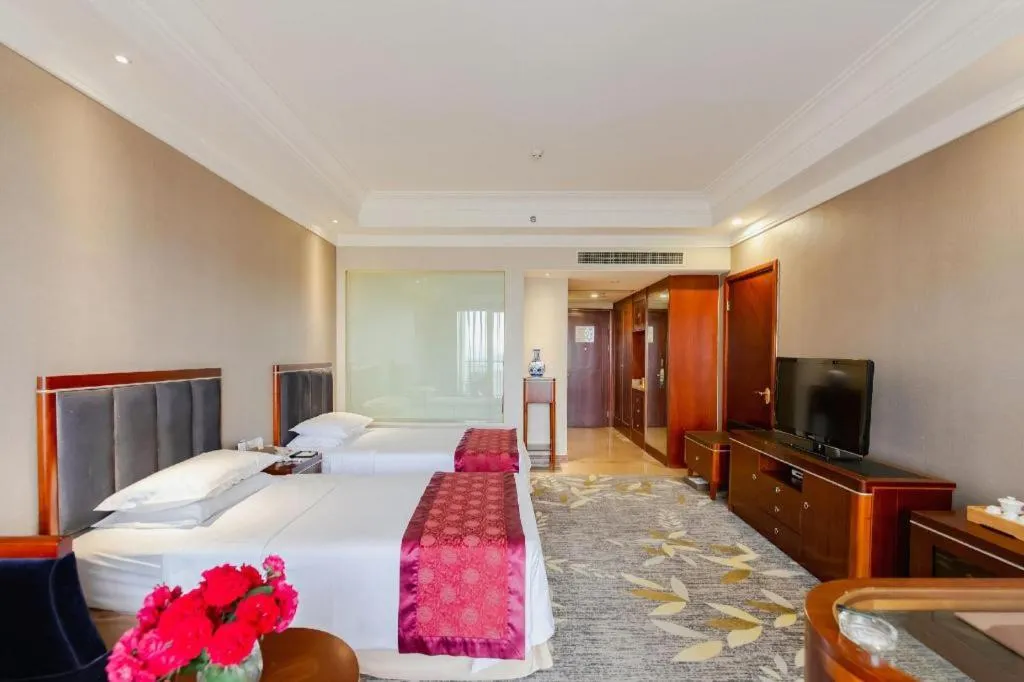 Bed in Xinjin Celebrity City Hotel