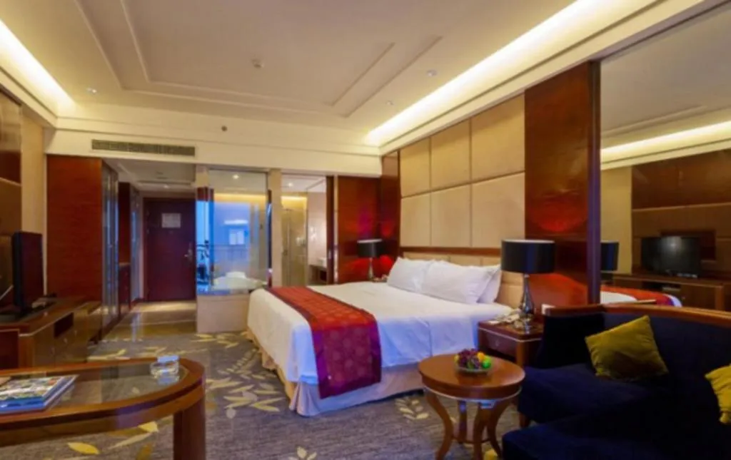 Bed in Xinjin Celebrity City Hotel