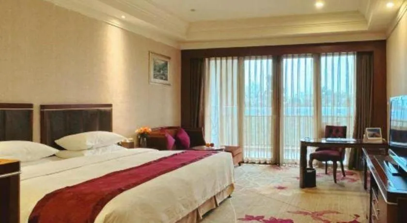 Bed in Xinjin Celebrity City Hotel