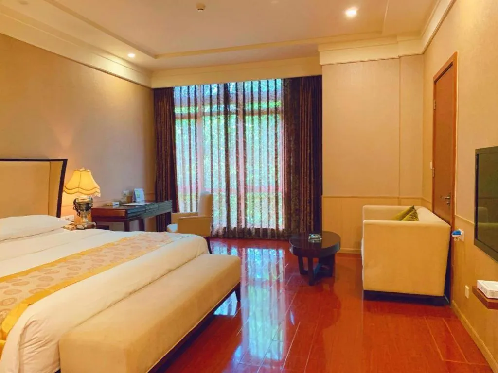 Bed in Xinjin Celebrity City Hotel