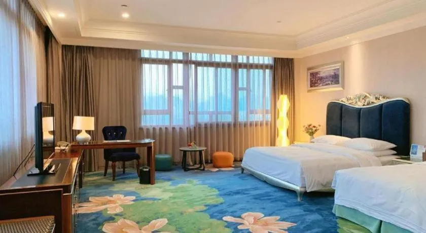 Bed in Xinjin Celebrity City Hotel