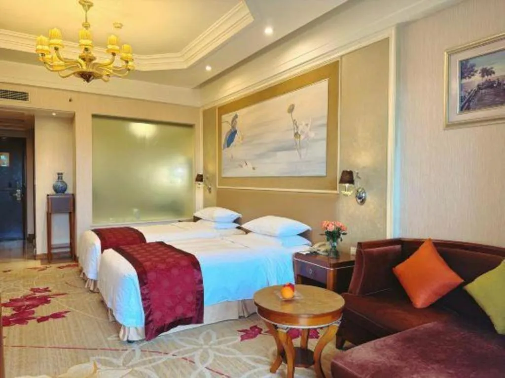 Bed in Xinjin Celebrity City Hotel