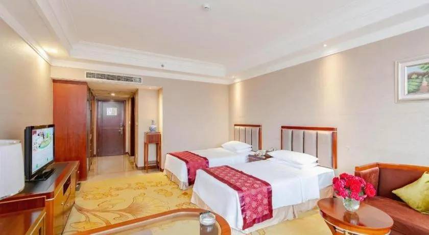 Bed in Xinjin Celebrity City Hotel