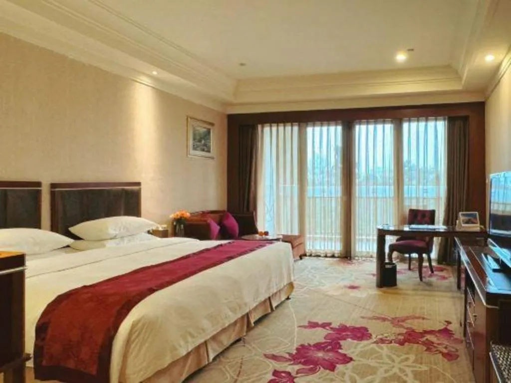 Bed in Xinjin Celebrity City Hotel