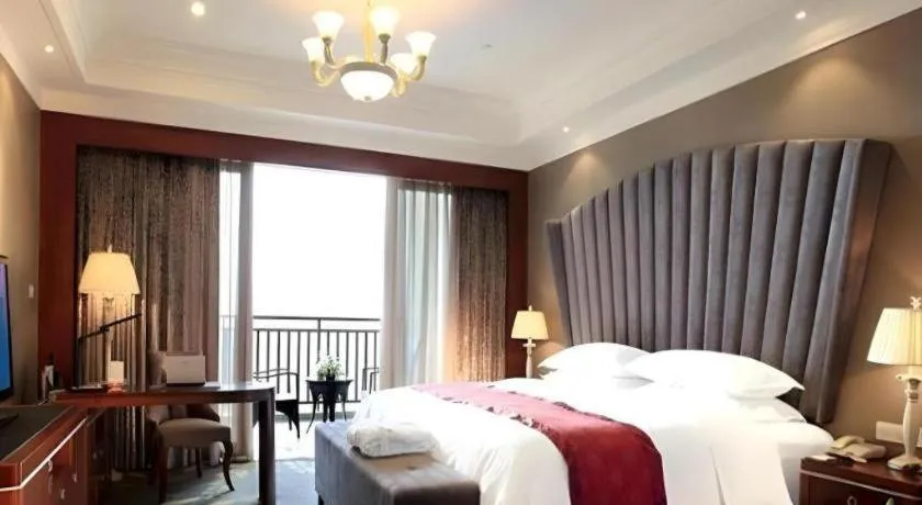 Bed in Xinjin Celebrity City Hotel