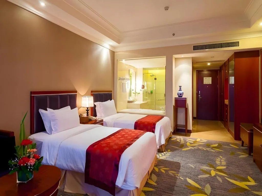 Bed in Xinjin Celebrity City Hotel