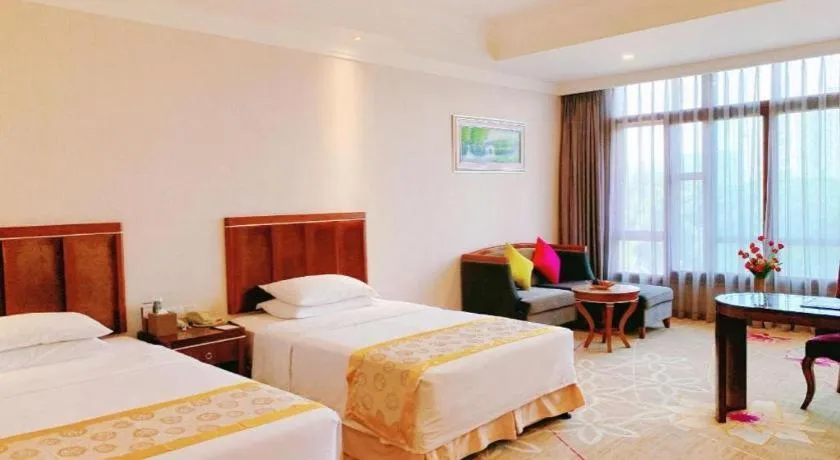 Bed in Xinjin Celebrity City Hotel